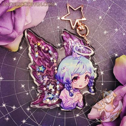 Shaker Charm of a cute angel with constellations in her wings.
