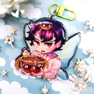 Shaker charm of a tooth fairy prince eating teeth.